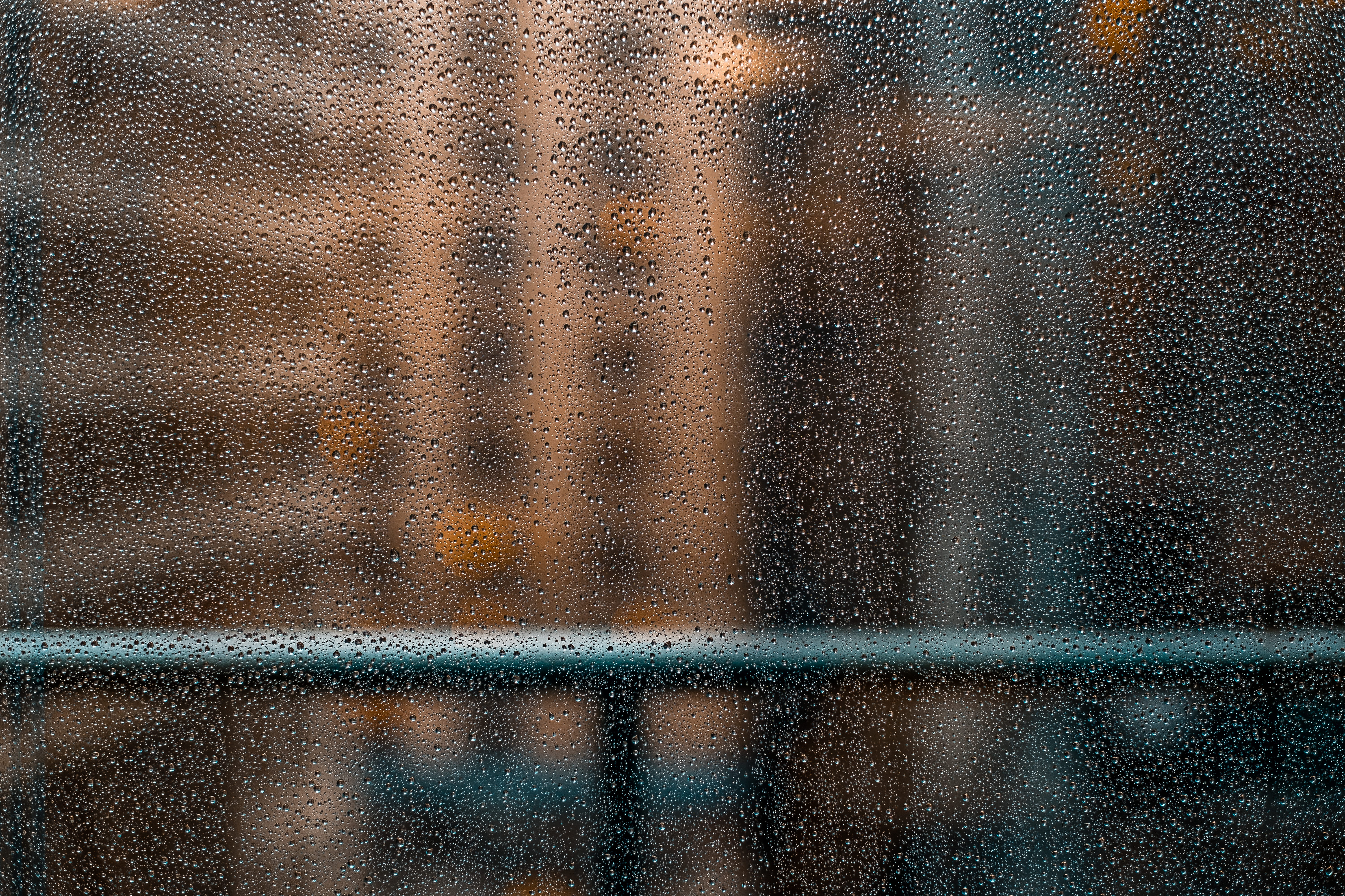 black metal fence near building, dew drop on glass, rainy, weather